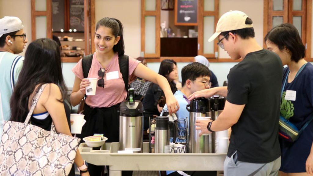 students serving up coffee