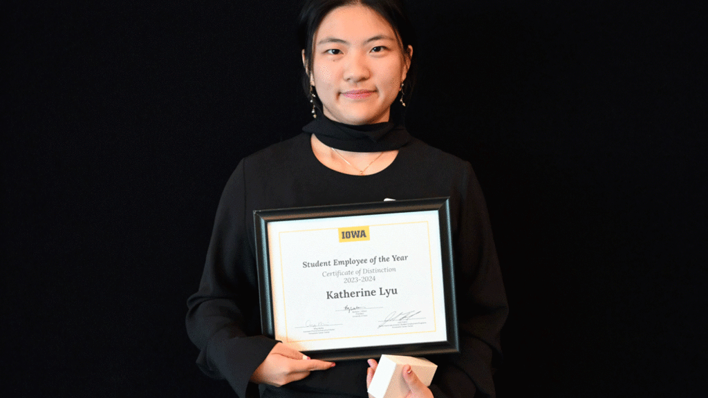 Katherine Lyu holding Student of the Year Award