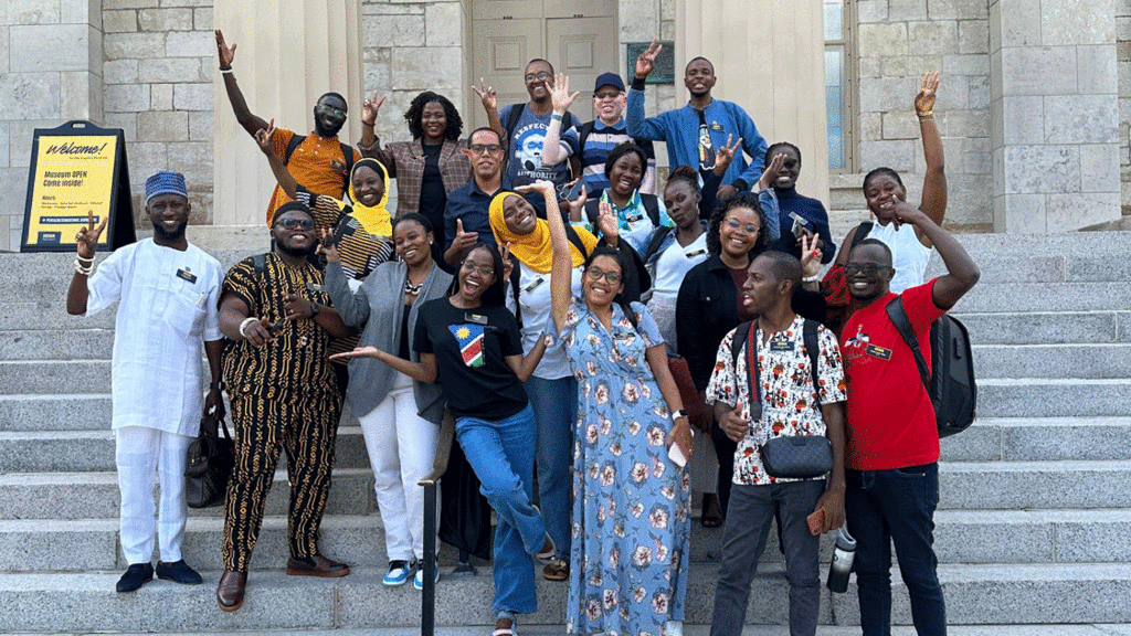 Ondela Mlandu (fifth from right) with other Mandela Fellows on the steps of the Old Capitol